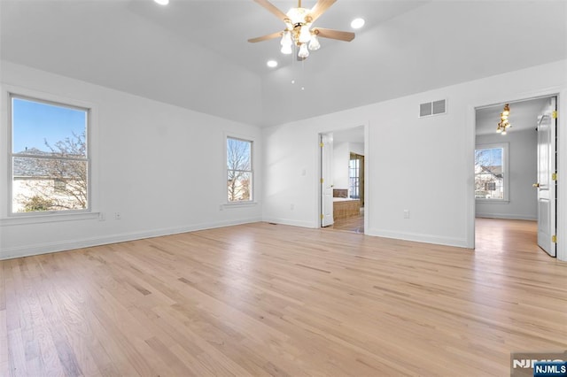 interior space featuring baseboards, visible vents, light wood-style flooring, and a ceiling fan