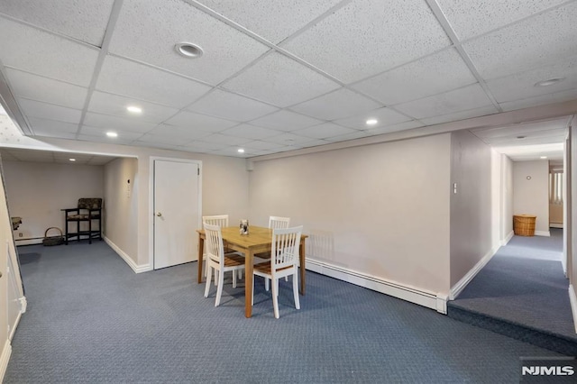 carpeted dining room with recessed lighting, baseboards, a drop ceiling, a baseboard radiator, and a baseboard heating unit