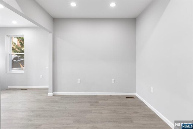 1457 67th St, North Bergen, NJ 07047 - empty room with recessed lighting, visible vents, baseboards, and wood finished floors