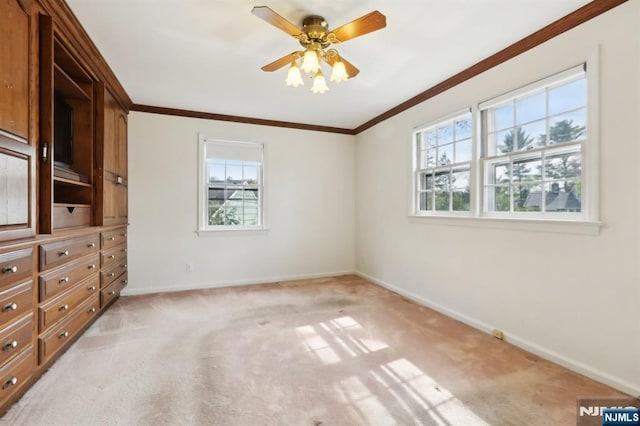 unfurnished bedroom with baseboards, ornamental molding, and light carpet
