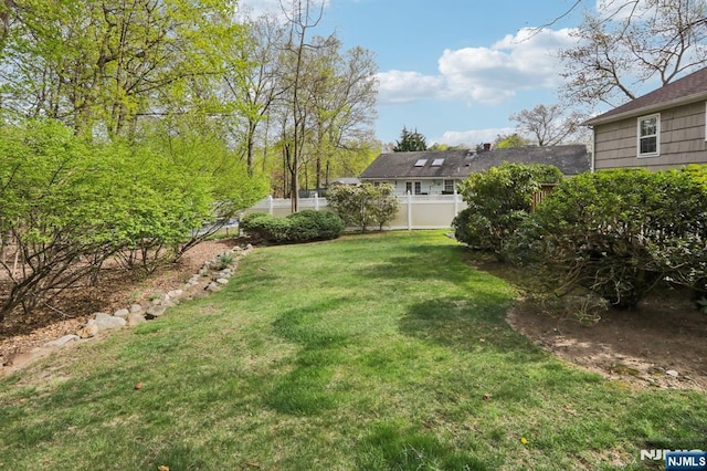 view of yard featuring fence