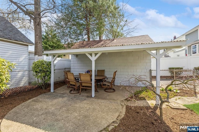 view of patio / terrace featuring fence and outdoor dining area