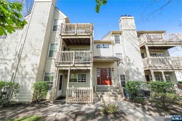view of front of home featuring a balcony