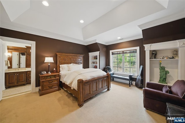 bedroom featuring recessed lighting, a raised ceiling, ornamental molding, a sink, and light colored carpet