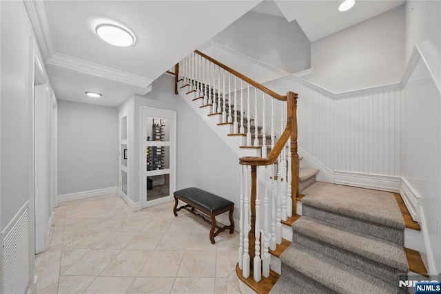 stairs with visible vents and ornamental molding