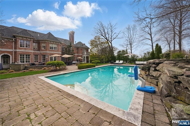 pool with a patio