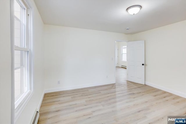 546 Morris St, Orange, NJ 07050 - unfurnished room with a baseboard heating unit, baseboard heating, light wood-type flooring, and baseboards
