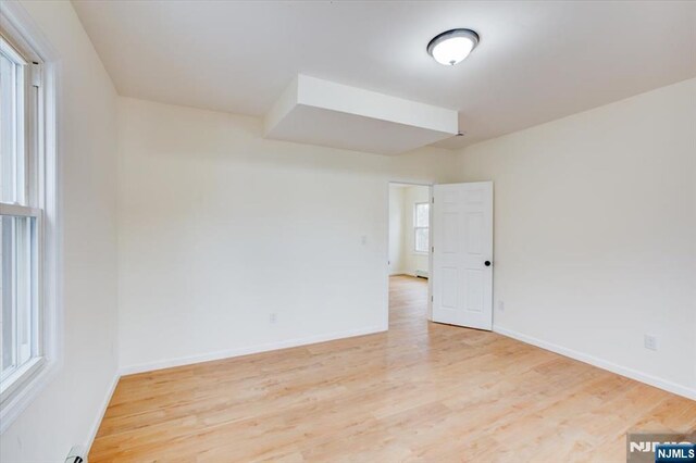 546 Morris St, Orange, NJ 07050 - empty room with light wood-style floors and baseboards