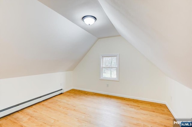546 Morris St, Orange, NJ 07050 - bonus room with baseboards, light wood finished floors, a baseboard heating unit, and vaulted ceiling