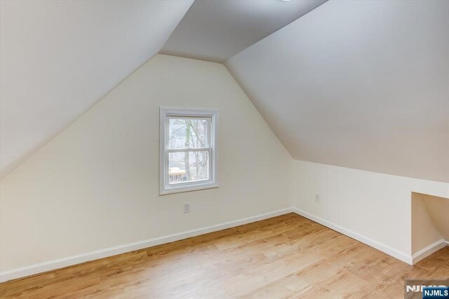 546 Morris St, Orange, NJ 07050 - bonus room with wood finished floors, baseboards, and lofted ceiling