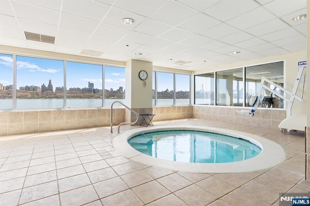 view of pool with a city view