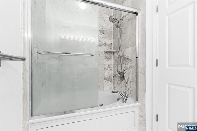 full bath with combined bath / shower with glass door