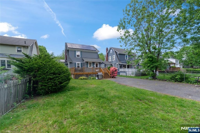 view of front of home with a deck and a residential view