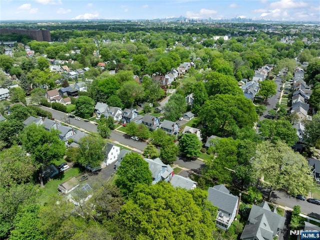aerial view of property's location with nearby suburban area