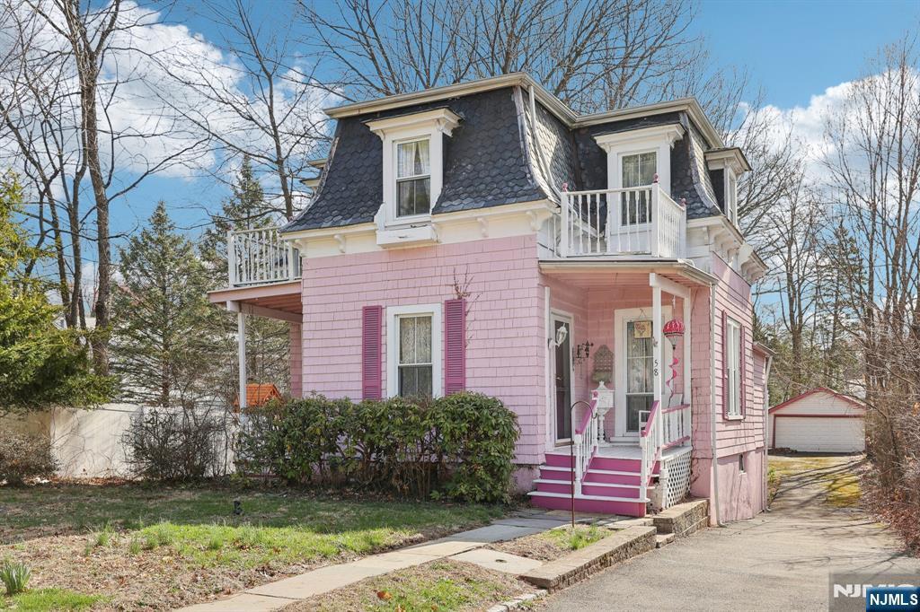 58 Ridgeway Ave, West Orange, NJ 07052 - second empire-style home with mansard roof, a balcony, an outbuilding, and a detached garage