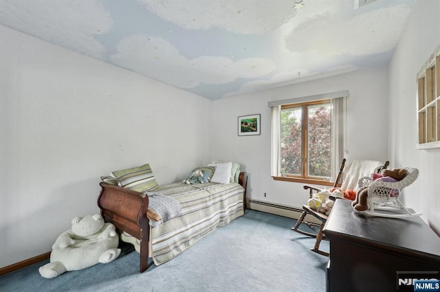 bedroom featuring carpet and a baseboard heating unit