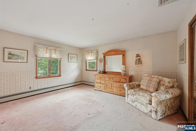 sitting room with wallpapered walls, a baseboard radiator, and carpet floors