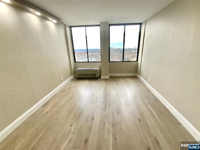 300 Winston Dr Unit 1722, Cliffside Park, NJ 07010 - empty room featuring baseboards and wood finished floors
