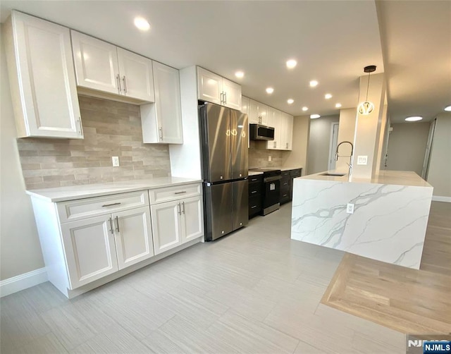 300 Winston Dr Unit 1722, Cliffside Park, NJ 07010 - kitchen with a sink, white cabinetry, recessed lighting, stainless steel appliances, and backsplash