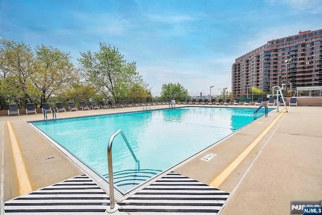 300 Winston Dr Unit 1722, Cliffside Park, NJ 07010 - community pool with a patio and fence