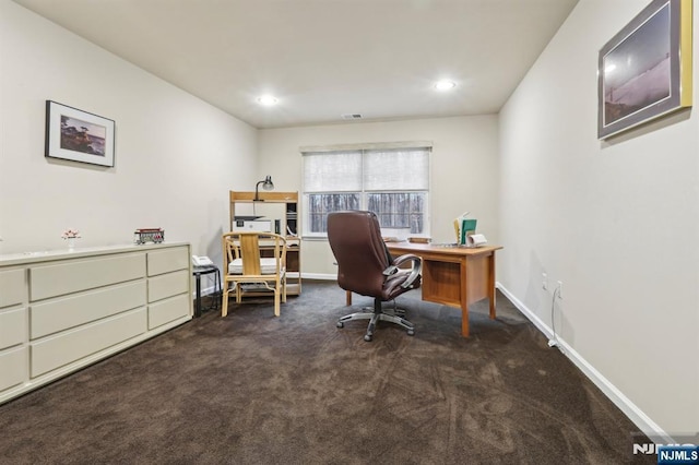 office area with recessed lighting, visible vents, baseboards, and dark carpet