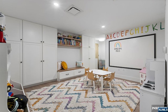 game room featuring wood finished floors, visible vents, and recessed lighting