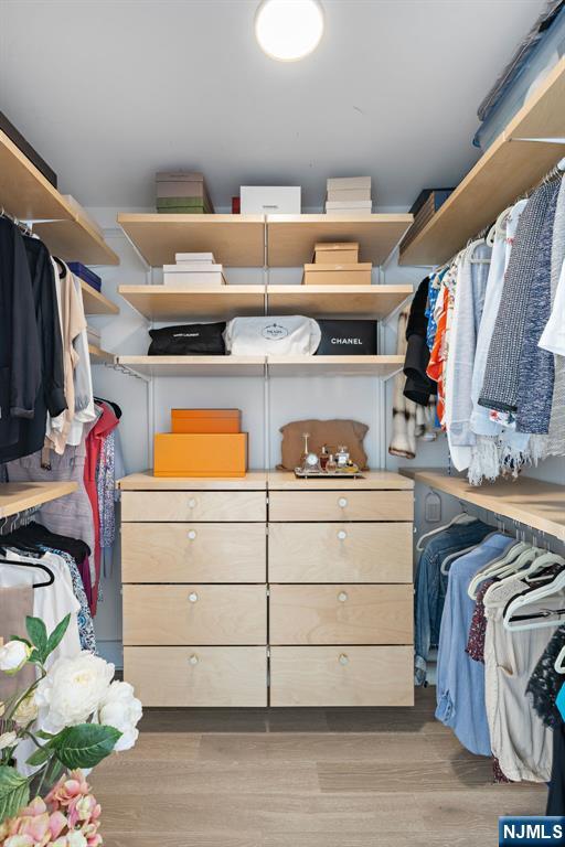 walk in closet featuring light wood-style floors