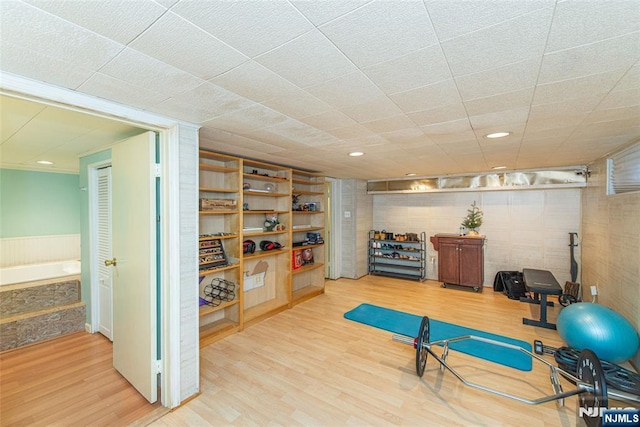 exercise area with wood finished floors