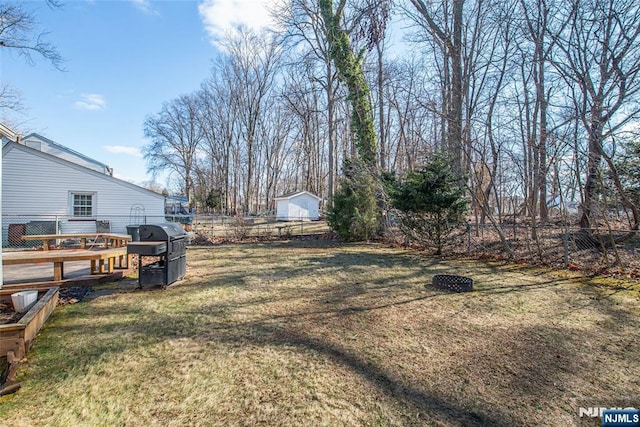 view of yard with a wooden deck and fence