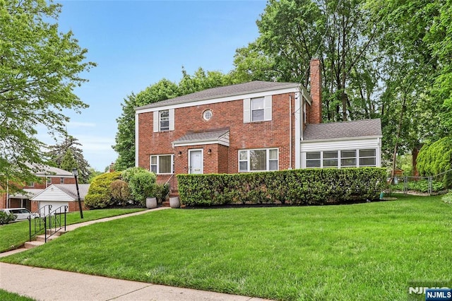 view of front of house with a chimney and brick siding