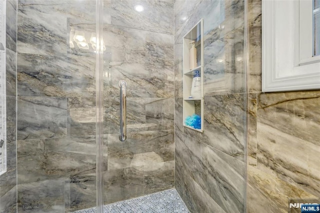 bathroom featuring a shower stall