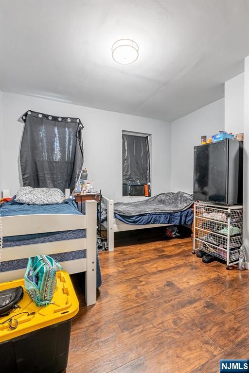110 Montgomery St, Paterson, NJ 07501 - bedroom with wood finished floors