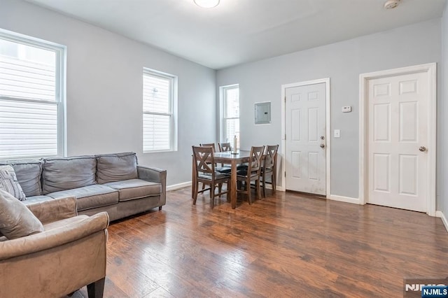 110 Montgomery St, Paterson, NJ 07501 - living area with electric panel, baseboards, and wood finished floors
