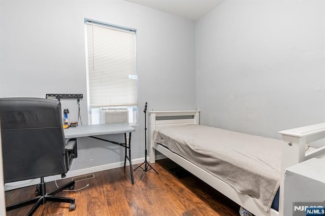 110 Montgomery St, Paterson, NJ 07501 - bedroom featuring baseboards, cooling unit, and wood finished floors