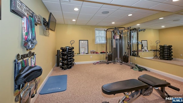 exercise room featuring recessed lighting, carpet flooring, and baseboards