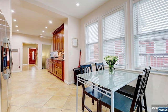 dining area featuring recessed lighting, baseboards, and light tile patterned floors