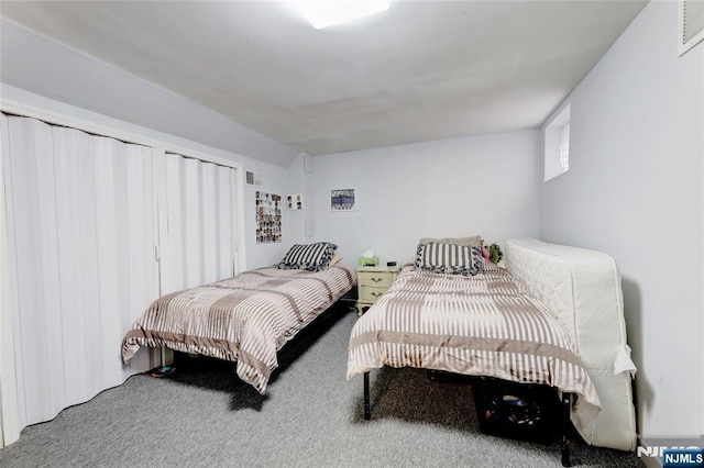 bedroom with carpet floors and visible vents