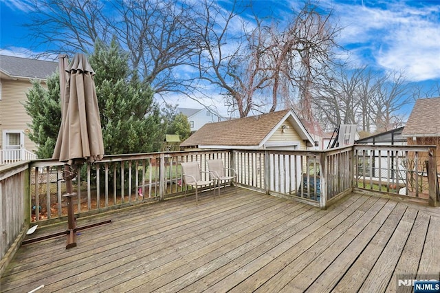 deck featuring an outdoor structure