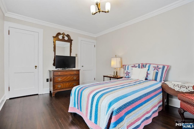 bedroom featuring a notable chandelier, baseboards, ornamental molding, and wood finished floors