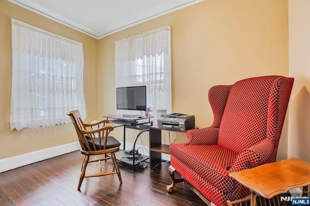 office featuring baseboards, ornamental molding, and wood finished floors