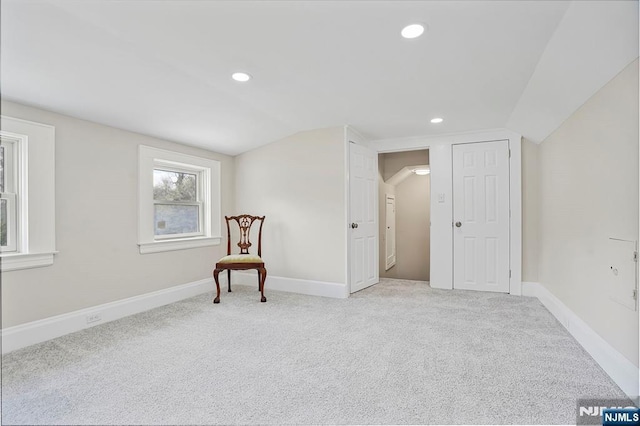 sitting room with baseboards, carpet, vaulted ceiling, and recessed lighting
