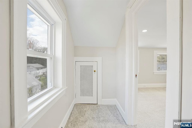 interior space featuring carpet flooring and baseboards
