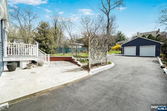exterior space featuring an outbuilding and a garage