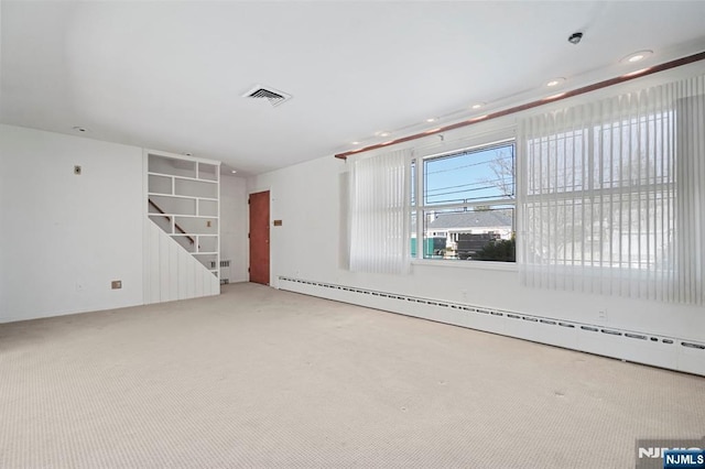 interior space featuring visible vents, carpet flooring, baseboard heating, and recessed lighting