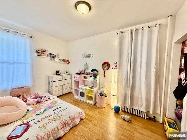 bedroom featuring light wood finished floors