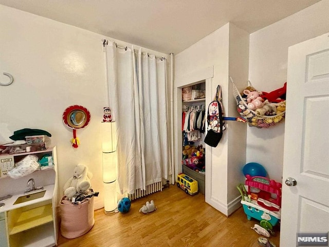bedroom with wood finished floors