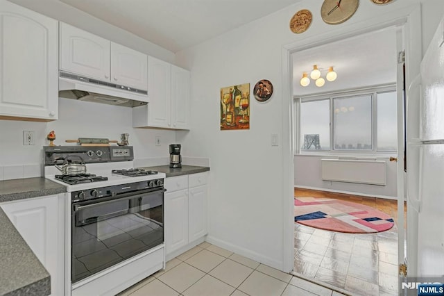 2150 Center Ave Unit 19A, Fort Lee, NJ 07024 - kitchen with under cabinet range hood, range with gas cooktop, and white cabinets