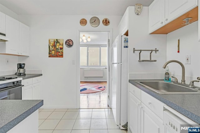 2150 Center Ave Unit 19A, Fort Lee, NJ 07024 - kitchen with white appliances, a sink, dark countertops, and white cabinets