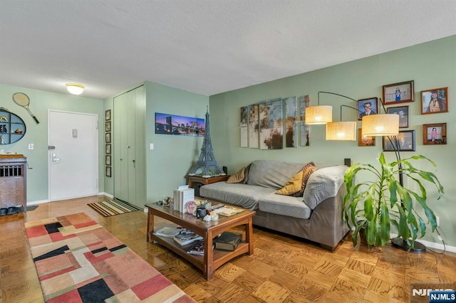 2150 Center Ave Unit 19A, Fort Lee, NJ 07024 - living area with baseboards and a textured ceiling