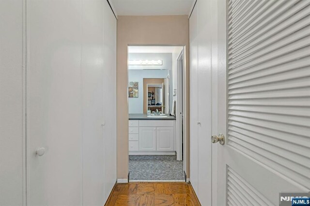 2150 Center Ave Unit 19A, Fort Lee, NJ 07024 - corridor featuring a sink
